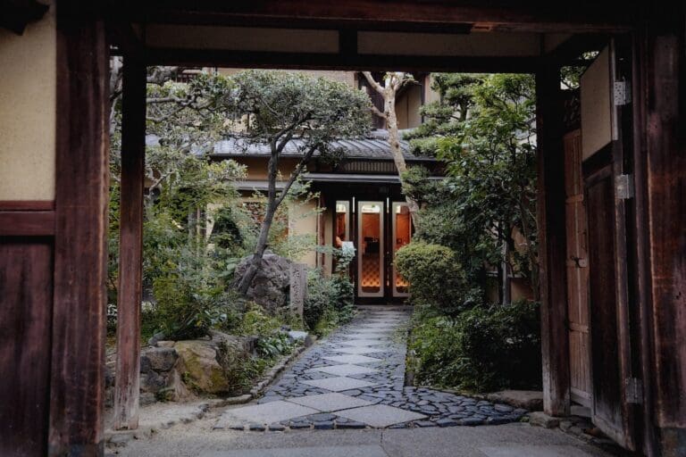 Stone path leading to the entrance of ryokan in Osaka, Japan