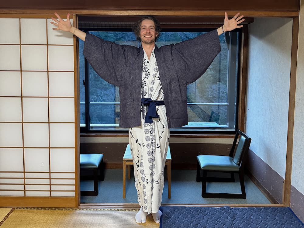 foreign tourist wearing a yukata in a ryokan in Kyoto, Japan