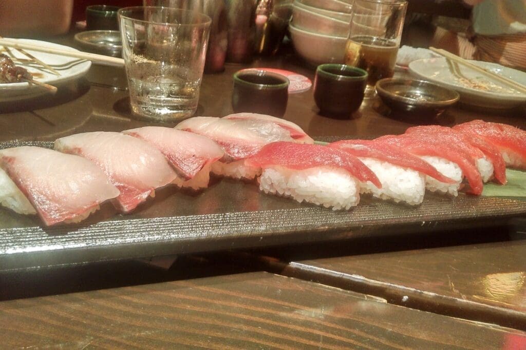 Plate of sushi on a table in a restaurant in Tokyo