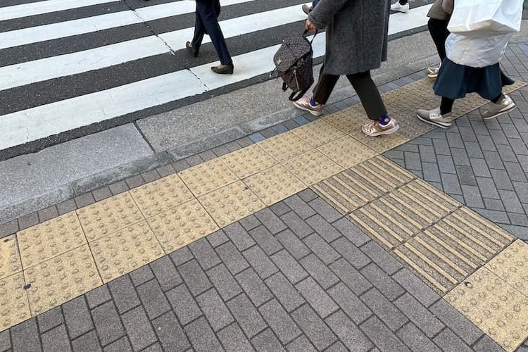 Tactile paving in the street in Tokyo, Japan, for blind or visually impaired people