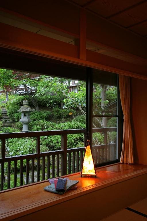 Window view of the garden from a Japanese-style room at Kanbayashi Hotel Senjukaku