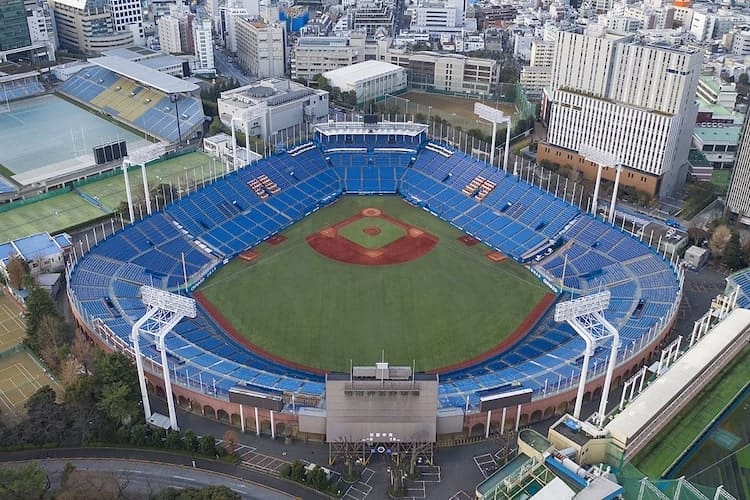 Aerial view of Meiji Jingu Stadium in Tokyo, Japan, showcasing the stadium's structure and surrounding greenery