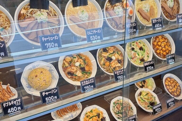 Plastic food items in the window of a Japanese restaurant