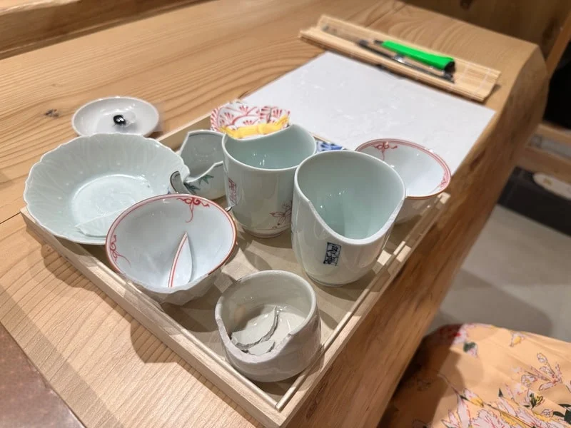Choice of broken Japanese pottery at a kintsugi workshop
