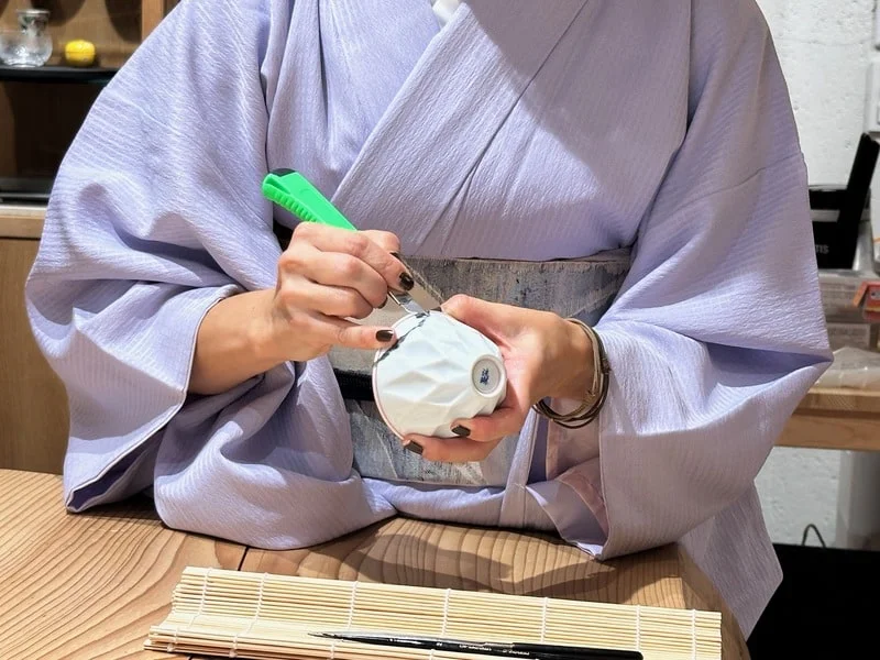 Broken pottery being repaired with kintsugi