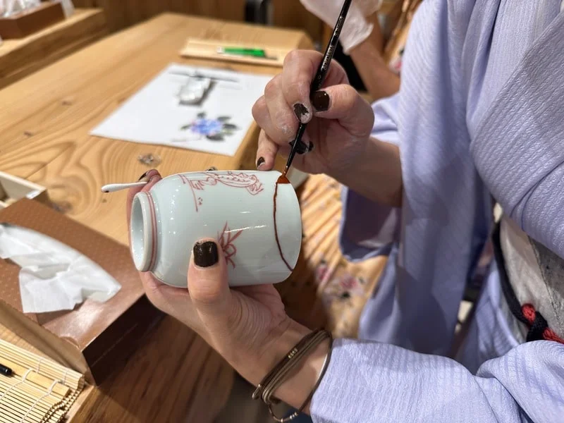 Broken pottery being repaired with lacquer at kintsugi class