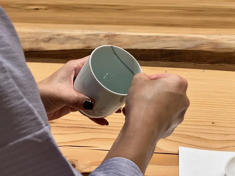 Instructor sanding the putty at a kintsugi workshop