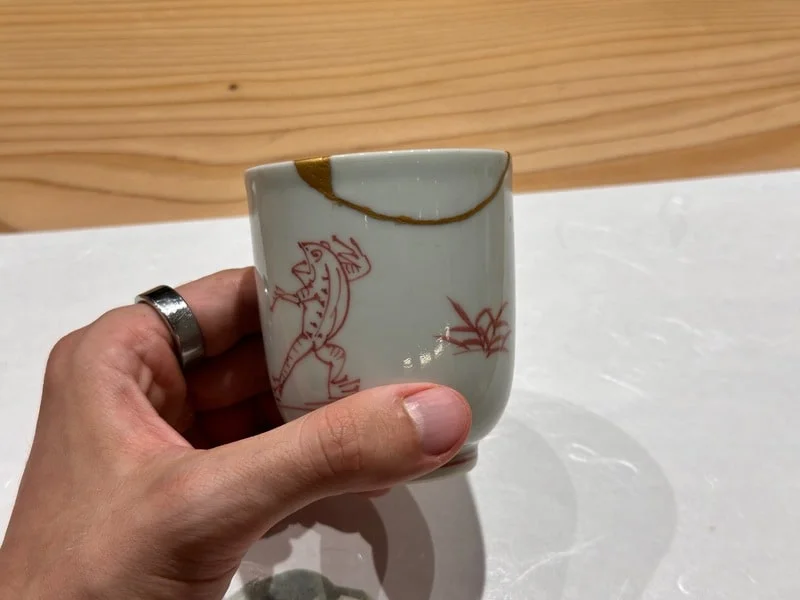 Broken Japanese pottery up repaired with kintsugi
