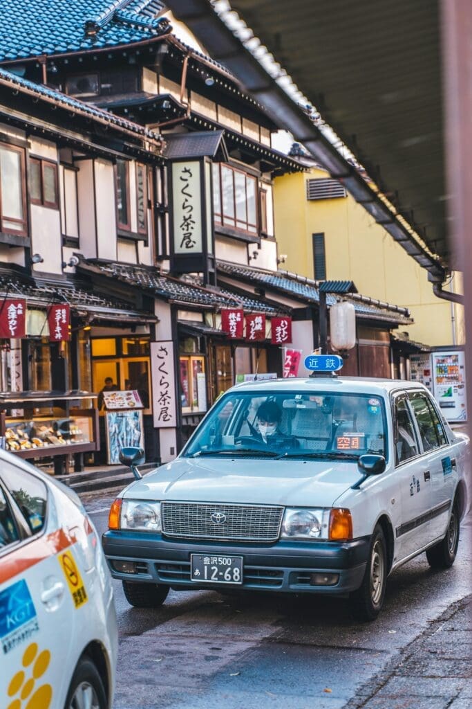 Taxi parked outside Sakura Chaya tea house on Kanazawa street