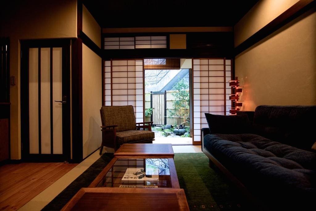 Kazueya ryokan tatami room with shoji doors opening to garden in Kanazawa