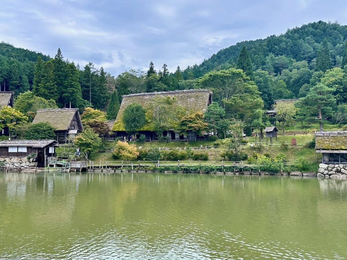Pond and traditional houses at Hida Folk Village