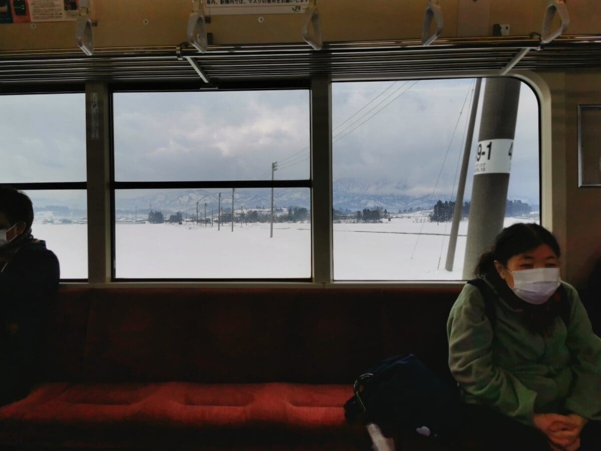 View from a train over snowy countryside in Tohoku